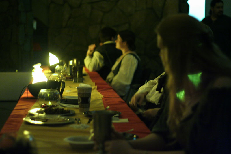 Companions relaxing at an Infidel's feast