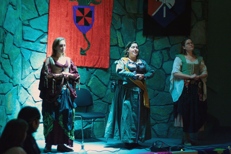 Companions sing for the crowd at Infidel's feast